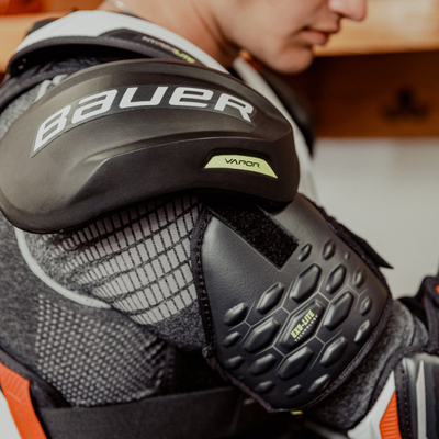 Bauer Vapor Hyperlite Hockey Shoulder Pads Intermediate 2022 person wearing this showing right shoulder/arm protection